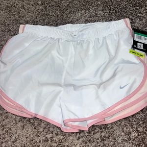 Pink and white Nike athletic shorts